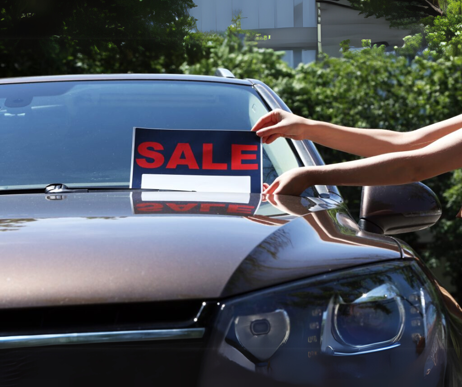 Used car with a sale sign, representing what buyers should know before purchasing a used vehicle.