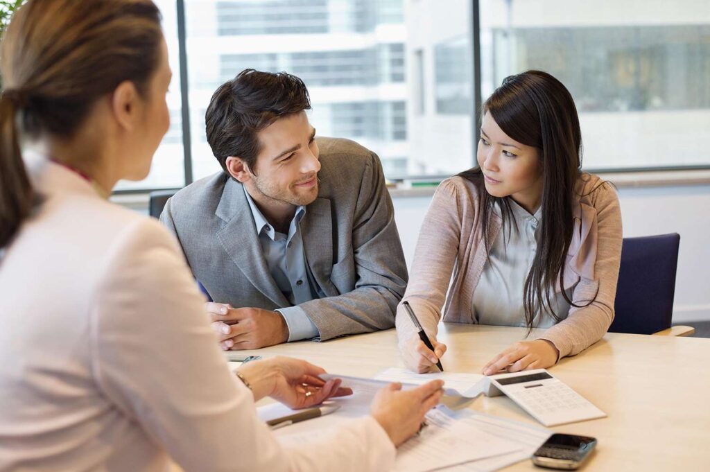 A woman co-signing for a man regarding loans