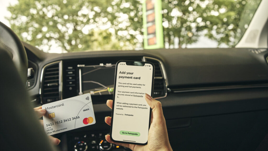 a person adding a card to their car payment