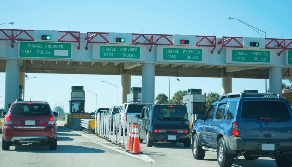 Cars going through a toll booth