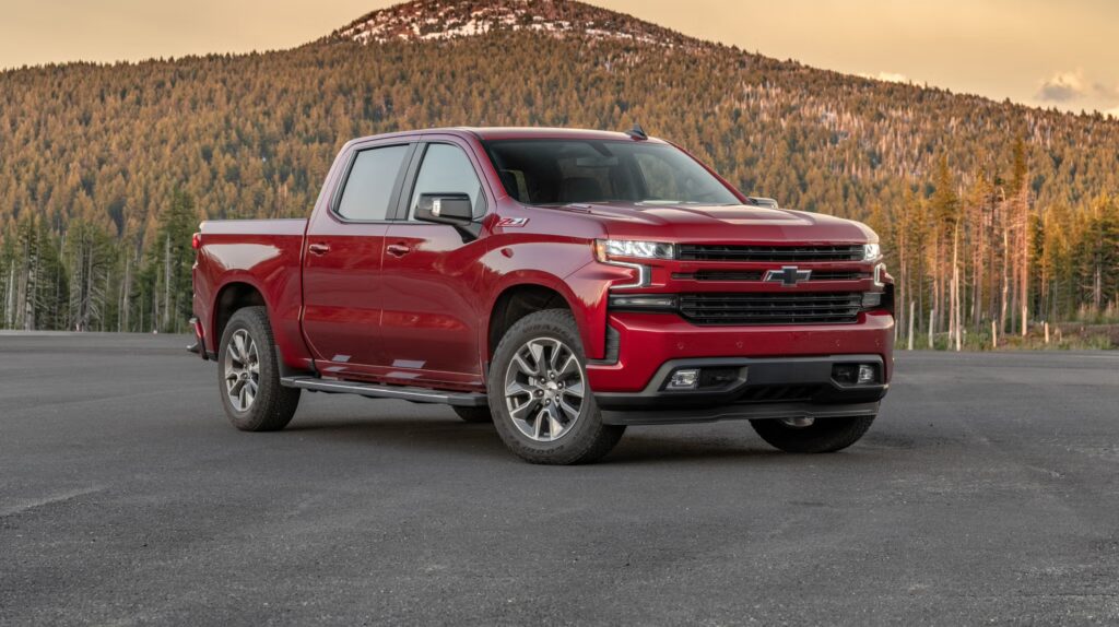 red 2020 Chevy Silverado 1500 parking in front a a mountain