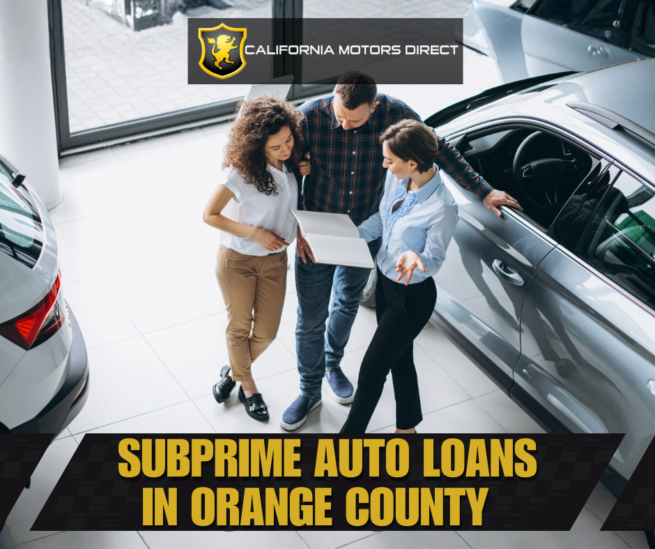 Car buyers reviewing financing options with a salesperson at a dealership, illustrating subprime auto loans in Orange County at California Motors Direct.