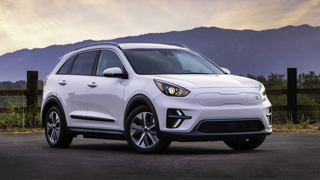 2022 Kia Niro EV crossover parked on a scenic road near the mountains.